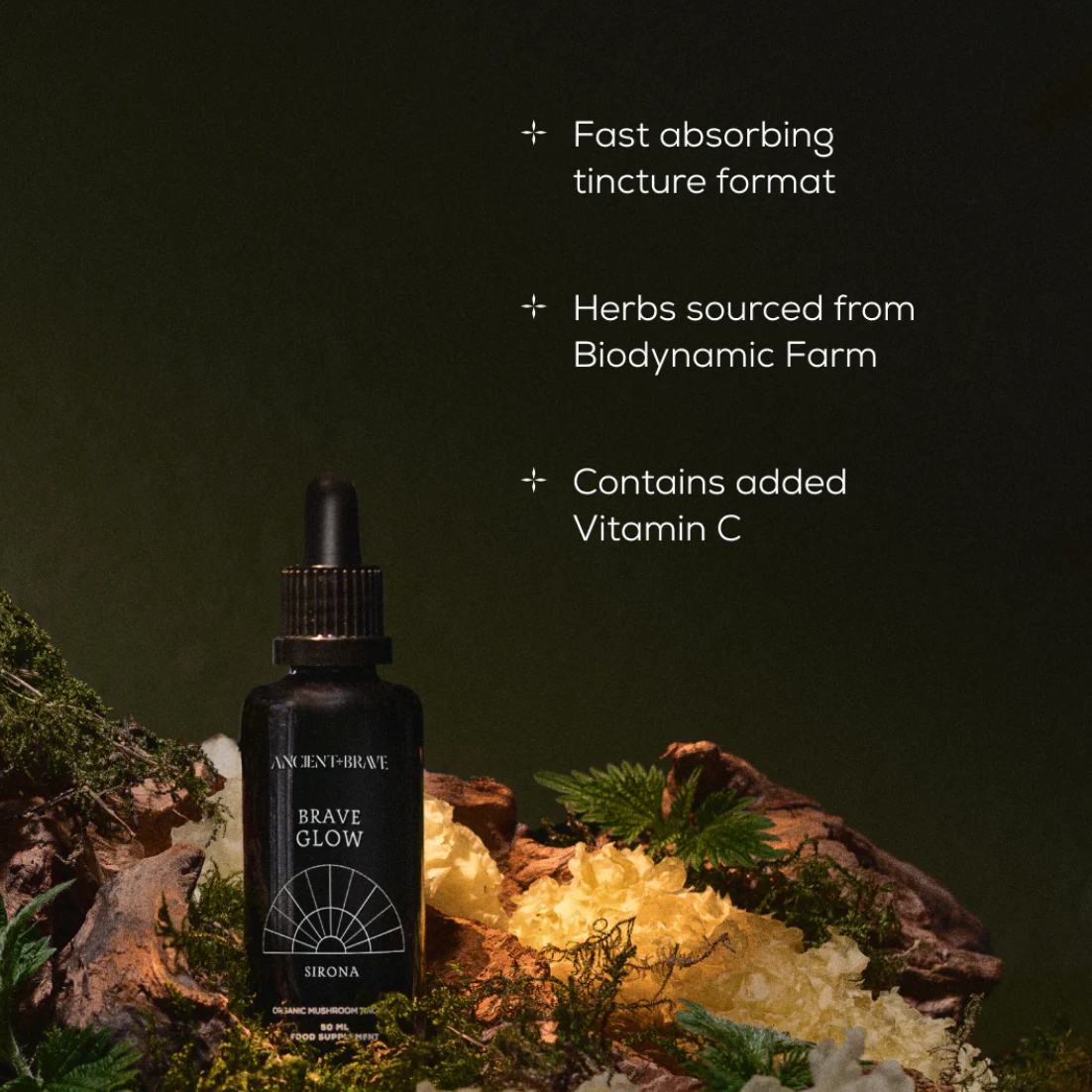 Black tincture bottle labeled &#39;Brave Glow&#39; with herbs and crystals on a dark background