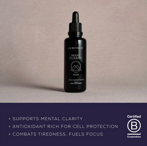 Purple bottle labeled 'Brave Clarity' on a white background