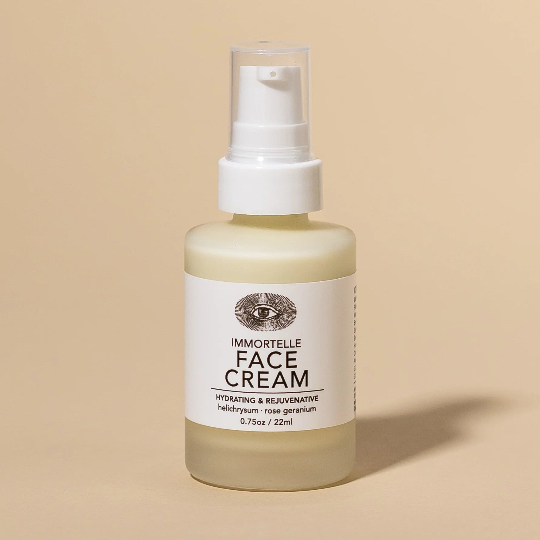 Bottle of Immortelle Face Cream on a beige background